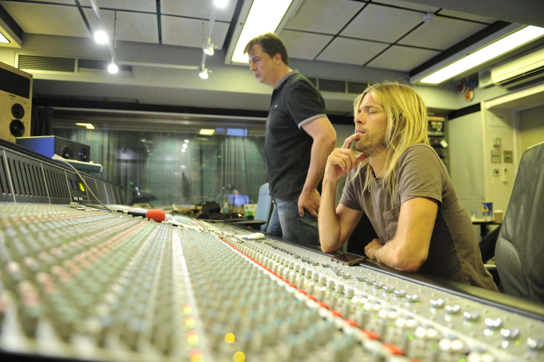 Taylor Hawkins at the mixing desk, Simon Askew behind him